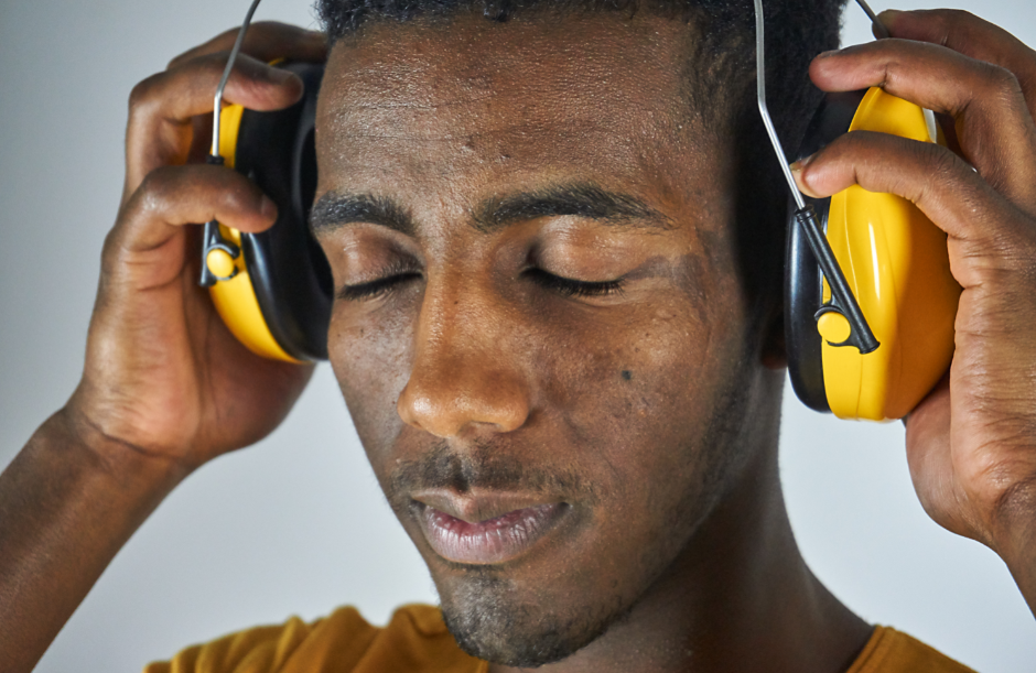 a man with eyes closed and headphones on