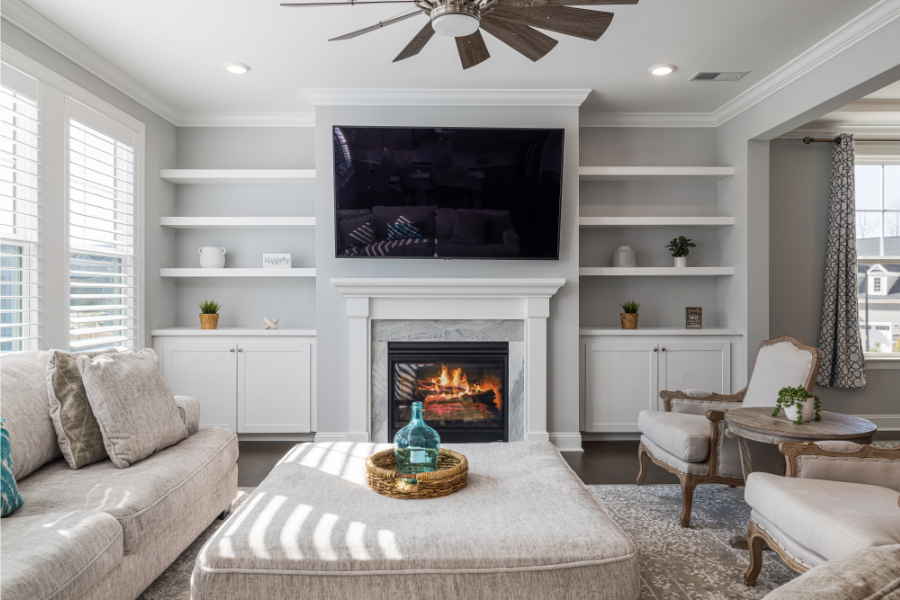 a staged living room with a fireplace